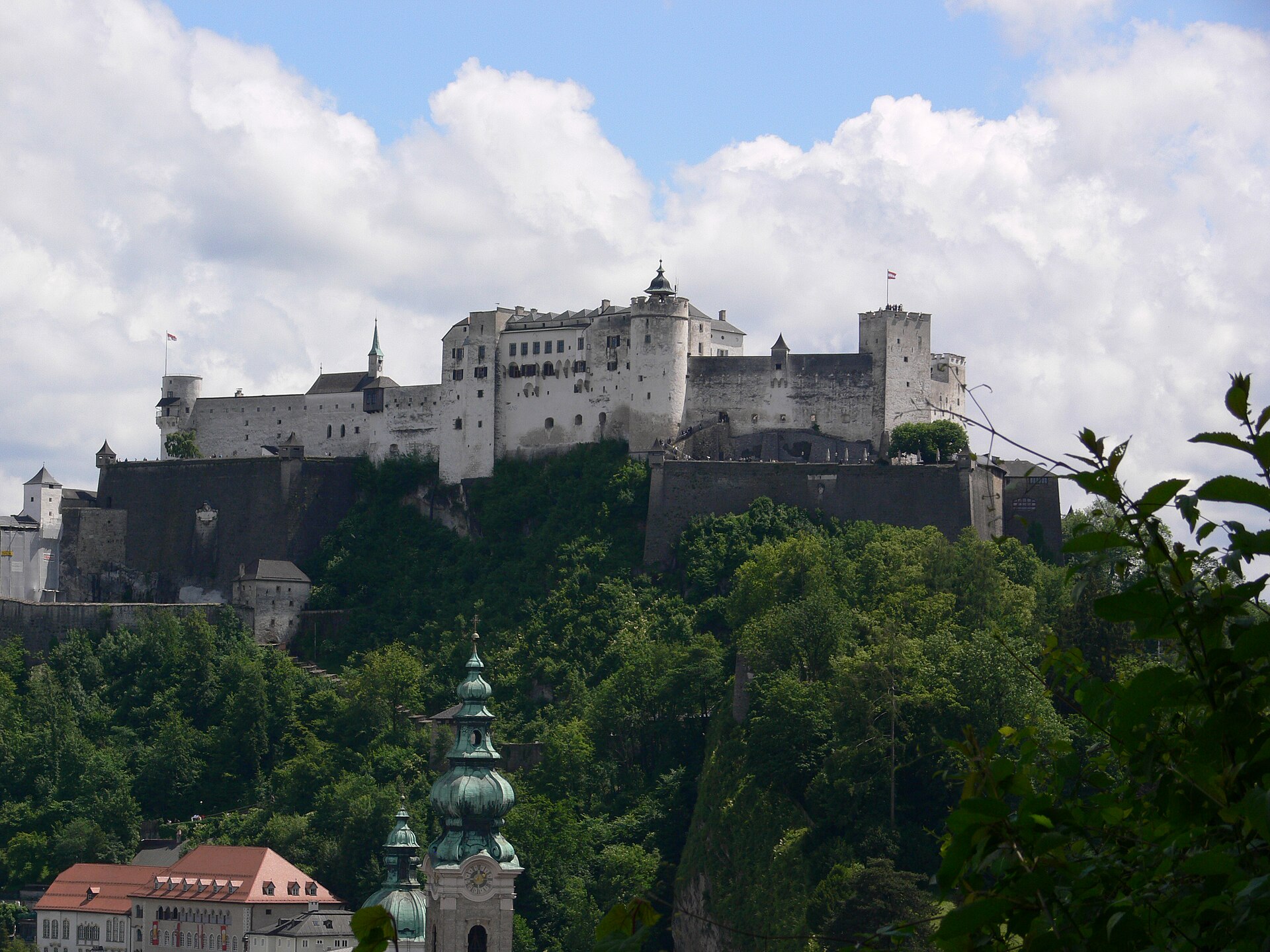 View of Salzburg old town with church towers and the Alps in the background